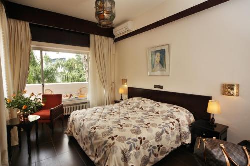 Vuode tai vuoteita majoituspaikassa Hotel Chellah