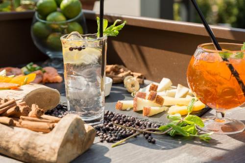 a table with a drink and food on it at Hotel Metropolitan in Bologna