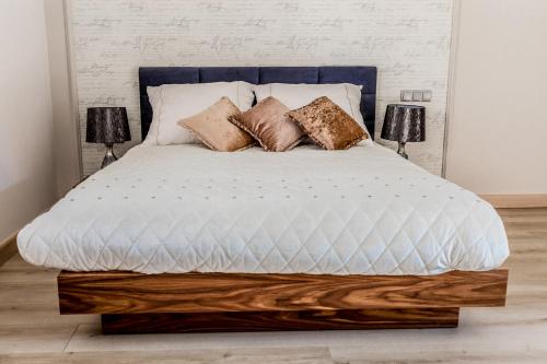 Łóżko lub łóżka w pokoju w obiekcie Apartamenty Glamour