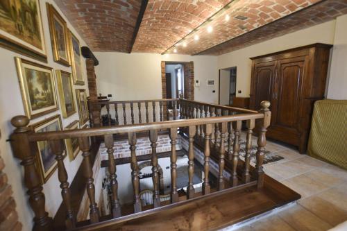 a spiral staircase in a home with a brick ceiling at B&B La Dolce Vita in Priocca