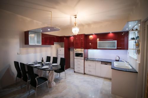 a kitchen with a table and chairs in a kitchen at Aias Summer House in Aiándion