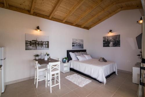 Ένα ή περισσότερα κρεβάτια σε δωμάτιο στο Estate Villa Duo