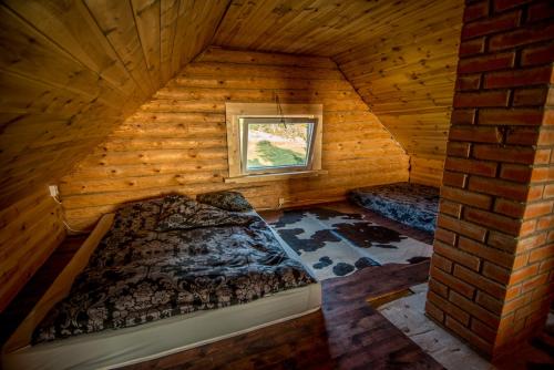 an overhead view of a bedroom in a log cabin at Northern Zen in Kaunispe