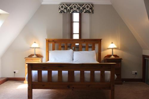 Postel nebo postele na pokoji v ubytování Stables Lodge