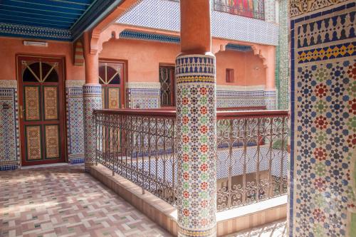 a balcony of a building with colorful tiles at Ryad Hamza in Marrakesh
