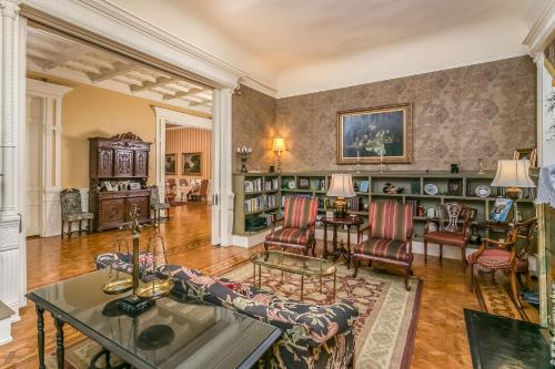 a living room with a couch and a table at The Mayor's Mansion Inn in Chattanooga