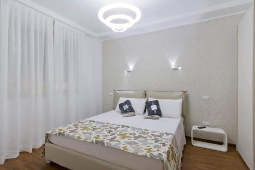 Ένα ή περισσότερα κρεβάτια σε δωμάτιο στο Central STEMA Luxury