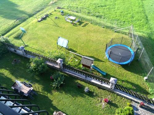 an aerial view of a miniature train on a field at Tatrzańska Panorama in Gliczarów