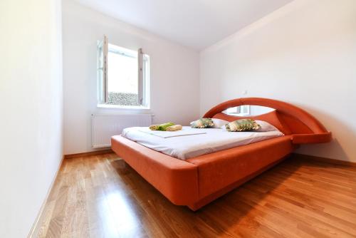 Postel nebo postele na pokoji v ubytování Apartman Hertz