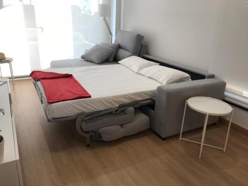 En eller flere senge i et værelse på Apartamentos Areas