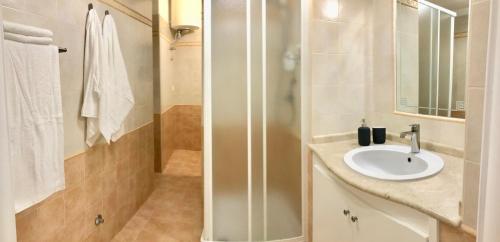 a bathroom with a sink and a shower at Studio Sant'Antonio in Pizzo
