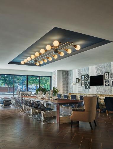 a large dining room with a long table and chairs at Graduate by Hilton Richmond in Richmond