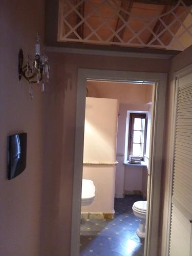 a bathroom with a toilet and a sink at B&B Villa Tonelli in Fivizzano