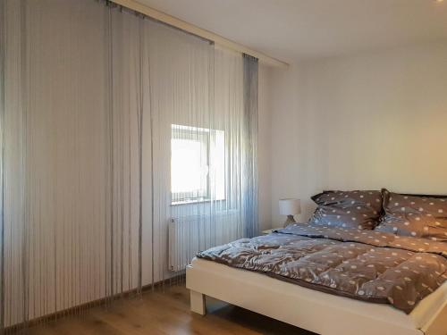 Säng eller sängar i ett rum på Luksusowe Apartamenty w Centrum Szczecina