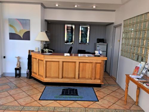 an office with a desk in the middle of a room at New England Motor Inn in Armidale