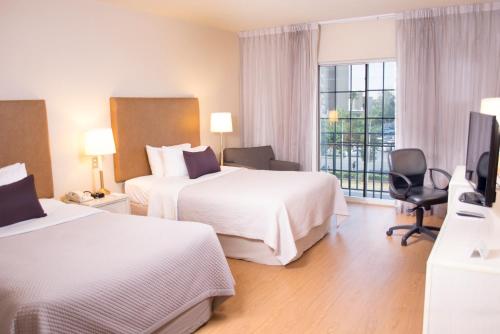 Postel nebo postele na pokoji v ubytování iStay Hotel Ciudad Juarez