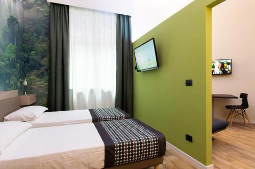 Ένα ή περισσότερα κρεβάτια σε δωμάτιο στο Aparthotel Porta Nuova