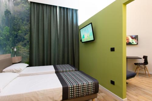 Ένα ή περισσότερα κρεβάτια σε δωμάτιο στο Aparthotel Porta Nuova