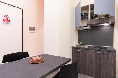 Η κουζίνα ή μικρή κουζίνα στο Aparthotel Porta Nuova