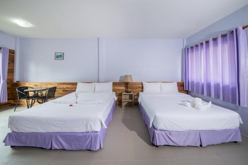 En eller flere senge i et værelse på Tontarn Resort & Spa
