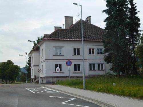 a white building on the side of a road at Byczy Rog noclehy na hranici in Králíky