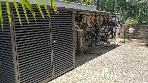 a garage with a bunch of bikes parked in it at Apartments and Rooms Degra in Umag