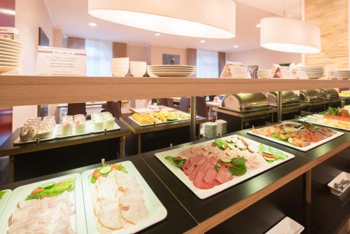 a buffet line with many different types of food at Best Western Hotel Breitbach in Ratingen