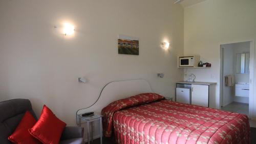 Ένα ή περισσότερα κρεβάτια σε δωμάτιο στο Bk's Counties Motor Lodge