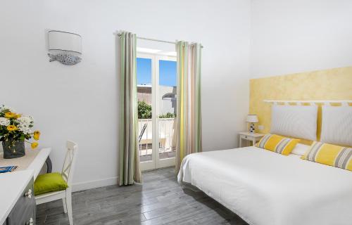 Postel nebo postele na pokoji v ubytování Elisir B&B