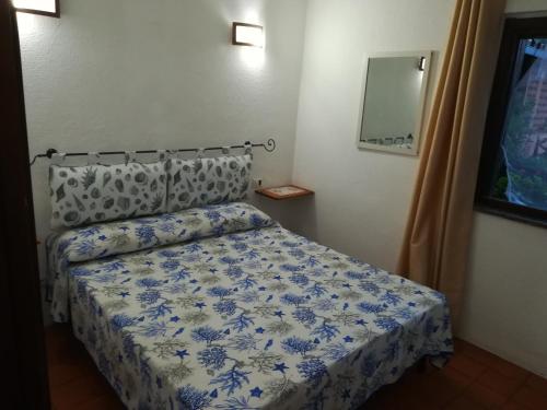 Villa Ginevra tesisinde bir odada yatak veya yataklar