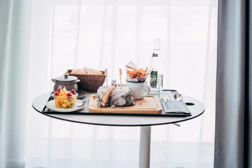 a table with a tray of food on it at Novotel Paris Coeur d'Orly Airport in Orly