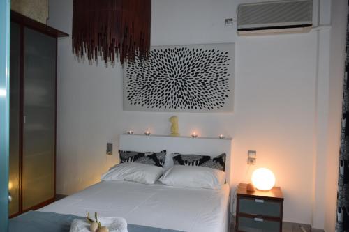 Postel nebo postele na pokoji v ubytování CLIO'S BEACH HOUSE - DELUXE BEACH FRONT PROPERTY