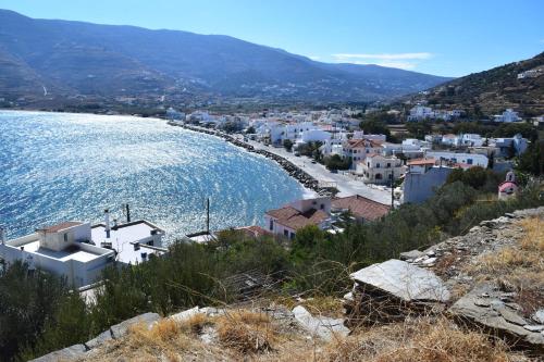 a view of a town on the shore of a body of water at CLIO'S BEACH HOUSE - DELUXE BEACH FRONT PROPERTY in Órmos
