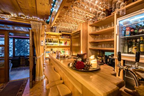 a bar with a long counter in a restaurant at Penzión Michal in Ždiar