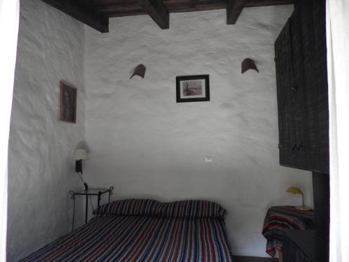 A bed or beds in a room at Casa Torre Antigua