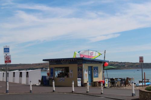 a small building with a kite on top of it at The Redcliff in Weymouth