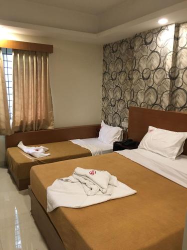 Hotel Grand Suitesにあるベッド