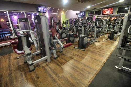 a gym with rows of treadmills and machines at Treacys West County Conference and Leisure Centre in Ennis