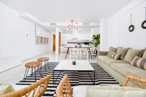 a living room with a couch and a table at iloftmalaga Deluxe Alameda Principal in Málaga