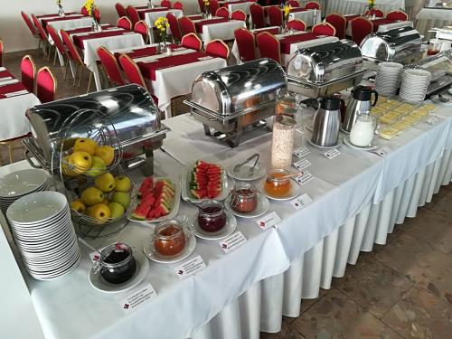 a white table with food on top at Hotel SATEL in Poprad