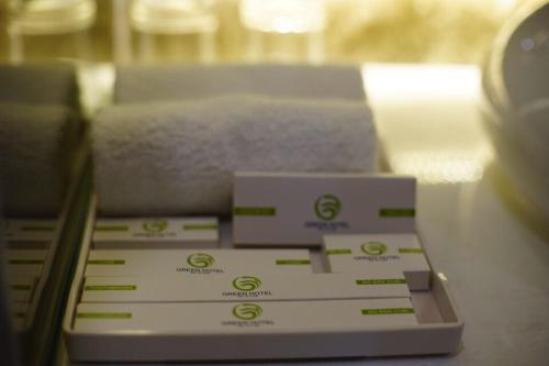 a stack of boxes sitting on top of a counter at Green Hadong Hotel in Hà Ðông