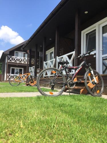 a couple of bikes parked outside of a house at Ostrivky in Svityazʼ