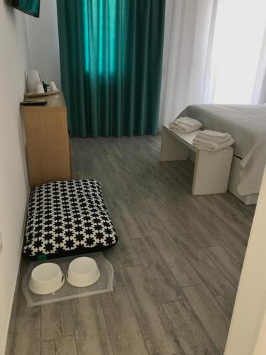 a small room with a bed and a table at Casa Mara in Chioggia