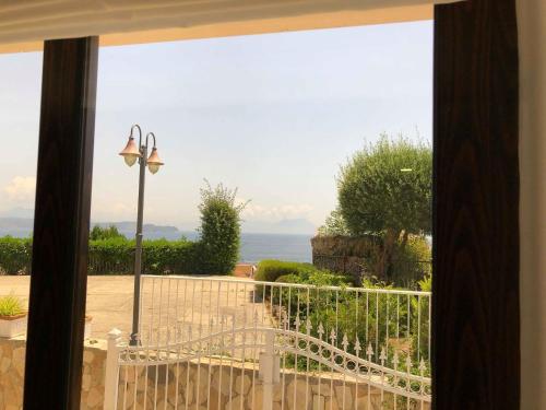 a view of the ocean from a window at Re Vincy - Affittacamere in Bacoli