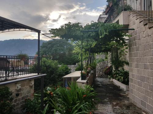 a view of a garden from a building at Gudelj Apartments in Perast