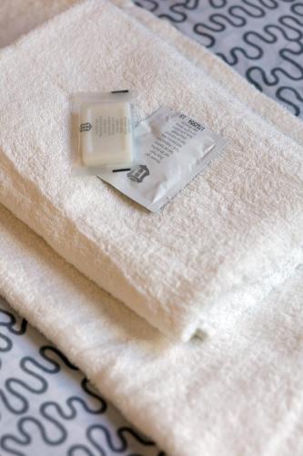 a electronic device sitting on top of a towel at Patio Hostel in Bratislava