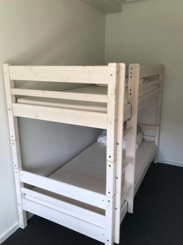 a white bunk bed in a room at Hotel Rødding in Rødding