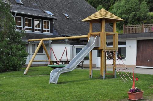 a playground with a slide and a gazebo at Hotel Zum Löwen - Unteres Wirtshaus in Titisee-Neustadt