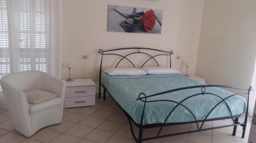 Łóżko lub łóżka w pokoju w obiekcie Appartamento in villa