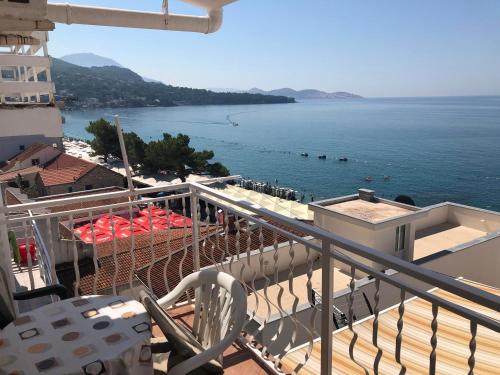 a balcony with a view of a body of water at Jelić apartmani in Sutomore